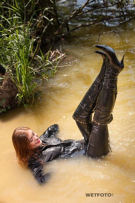 Soaking Wet Girl In Leather Jacket Leggings And Leather Boots With