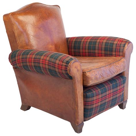 The chair will make all the other arm chairs jealous with its modern look and stylish cane arms! Small-Scale Club Chair in Leather and Tartan Plaid at 1stdibs