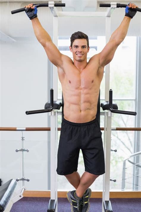 Shirtless Male Body Builder Doing Pull Ups Stock Photo Image Of Care