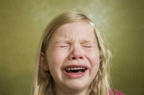 Sad Girl Crying At Home Stock Photo