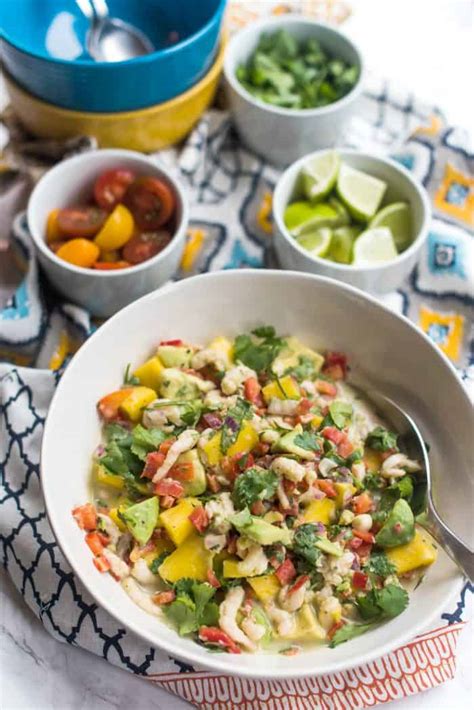This shrimp ceviche is made with limes, lemon, red onion, cucumber, chile peppers, cilantro, and avocado. Shrimp Ceviche Recipe With Mango and Avocado - Reluctant ...