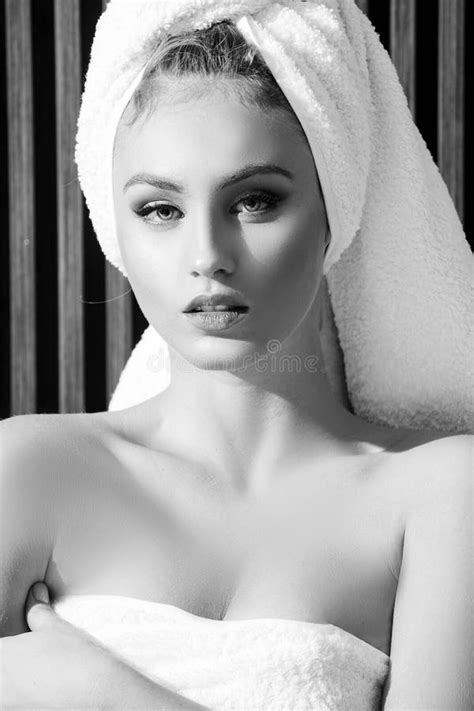 Portrait Of Sensual Woman With A Towel Wrapped Around Her Head Looking