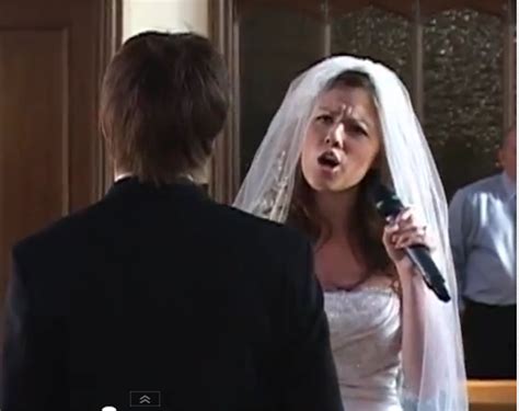 awkward bride sings her way down the aisle to her groom