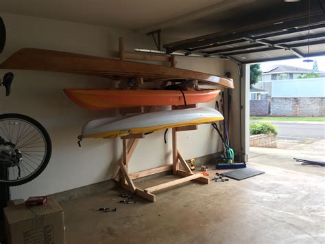 Triple kayak rack for garage made from 2x4s | Garage kayak rack, Kayak