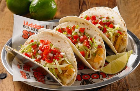 Soft fresh corn tortillas, stacked with seasoned chunks of slow roasted pork, chopped onions & cilantro topped with roasted salsa. Hooters México
