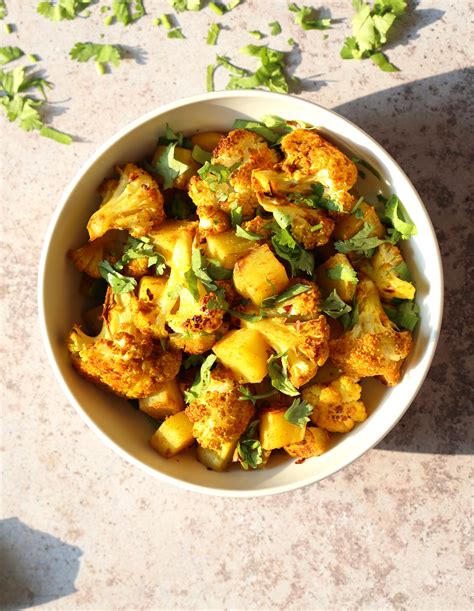 Here is the recipe for sukha aloo gobi or dry potato cauliflower Baked Aloo Gobi Vegan Recipe - Indian Spiced Potato ...