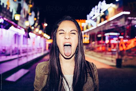 Girl Sticking Tongue Out By Michela Ravasio