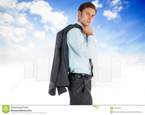 Composite Image Of Serious Businessman Holding His Jacket Stock Image