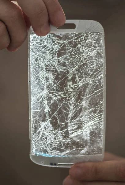 Hands Holding A Broken Screen Of Smartphone Stock Image Everypixel
