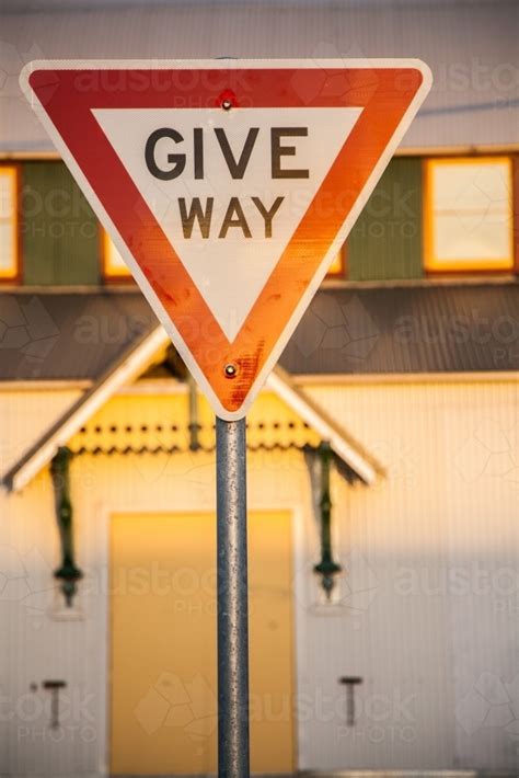 Image Of Golden Afternoon Sun Reflecting Off Give Way Road Sign In