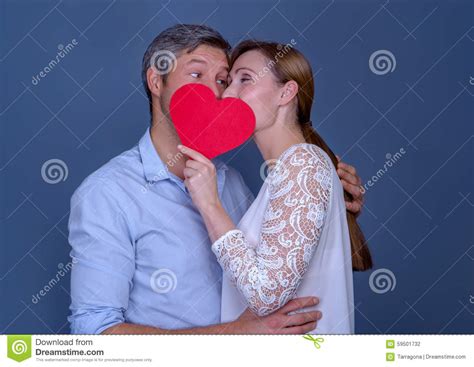 Portrait Of Kissing Couple In The Garden Stock Photography