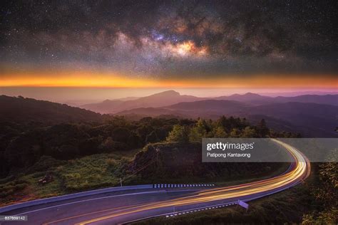 Milky Way On The Top Mountain And Road At Front In Intanon Mountain