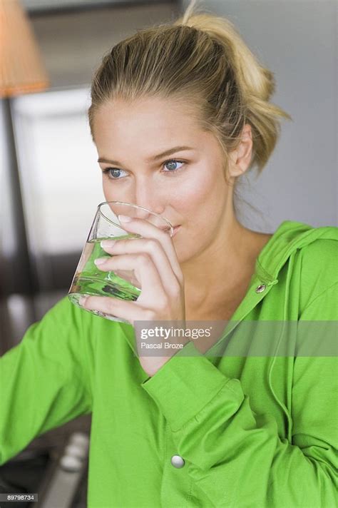 Closeup Of A Woman Drinking Water From A Glass High Res Stock Photo