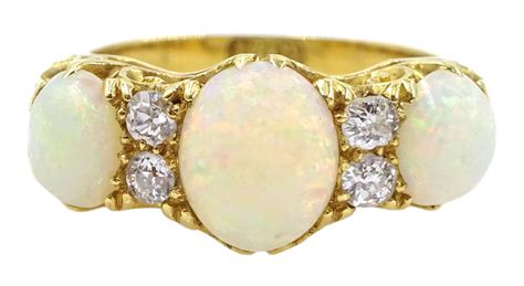 Early 20th Century Opal And Diamond Ring Three Oval Opals With Four
