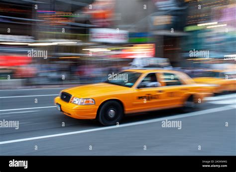 Yellow New York Taxi Cab Driving Fast On A Street In New York City Usa