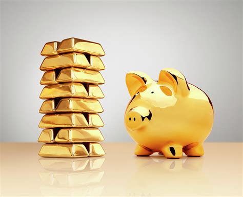 Pig bank golden plating with crown. Gold Piggy Bank Beside A Stack Of Ingots by Anthony Bradshaw