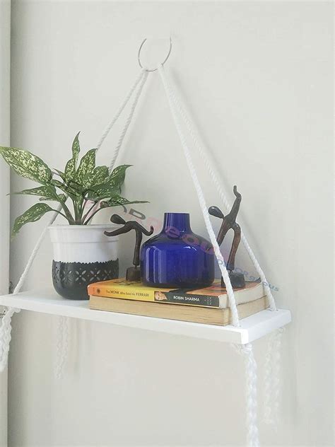 Hanging shelves not only add a rustic element to you home décor, but you can also a smaller piece will do well as a side shelf, night stand or side table, and a larger piece will probably do better as. This bohemian Nordic-style hanging shelf that you can also ...