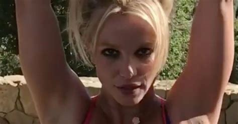 Ill watch this clip again. Britney Spears' boobs burst out of her sports bra as she ...