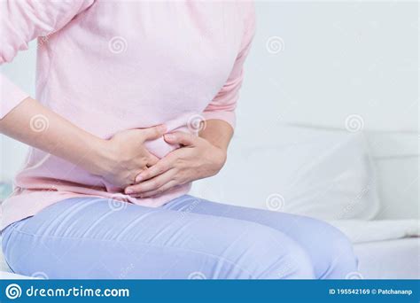 Young Upset Unhappy Woman Suffering From Menstruation Pain Pms At Home