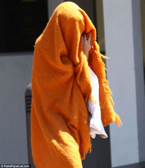 Selena Gomez Tries To Hide Herself In Bright Orange Blanket As Tawdry
