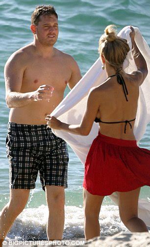 Something to hide Mooblée Michael Bublé keeps things covered on beach