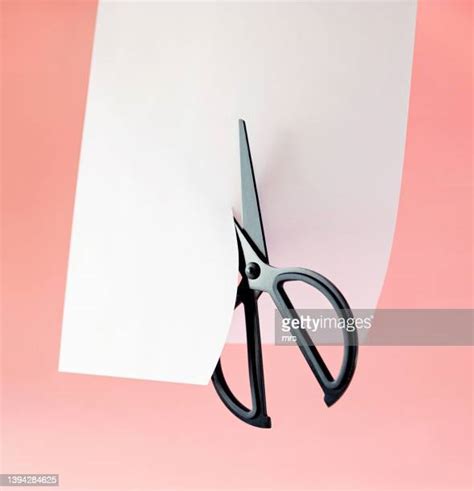 Cutting Paper With Scissors Photos And Premium High Res Pictures