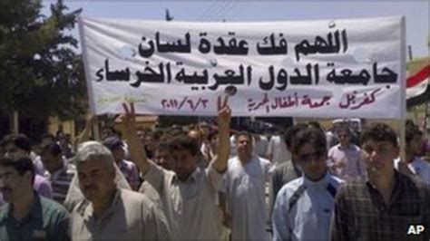 syria dozens killed as thousands protest in hama bbc news