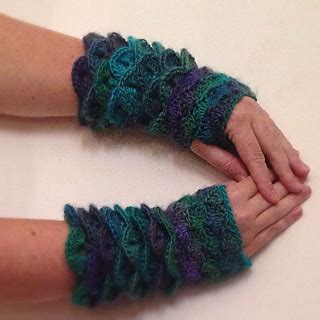 One style of fingerless gloves that is popular with fans of fantasy tv programs featuring thrones and dragons are dragon scale gloves. Ravelry: Dragon Scale Gloves pattern by Tomboy Nanny