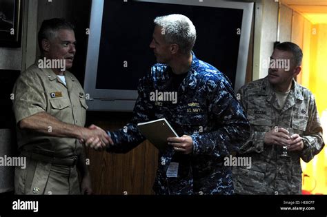 Us Navy Captain Logan Jones Greets Navy Cmdr Charles Phillip Aboard