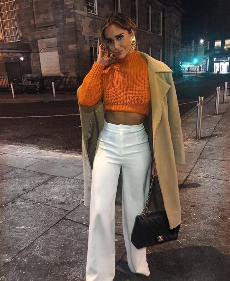 We did not find results for: Classic coat over cute orange cropped sweater and winter white pants with chic black leather ...