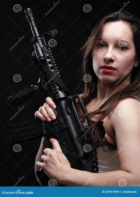 Girl Holding Rifle On Black Background Royalty Free Stock Images