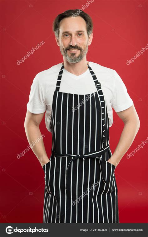 Skilled And Confident Senior Cook Wearing Bib Apron Bearded Mature Man In Striped Apron