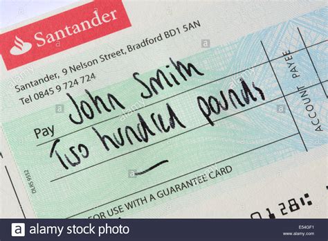 In today's post, i will show what a cancelled cheque is and how to cancel a cheque? Santander Bank Cheque Payable To John Smith Stock Photo ...