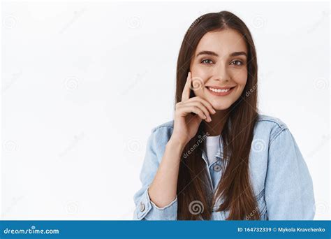 close up sassy good looking stylish brunette woman with long straight hair smiling pleased with