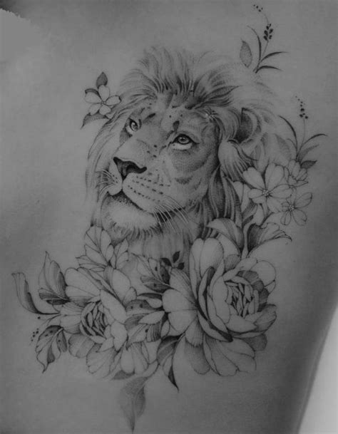 A Womans Back With A Lion And Flowers On It