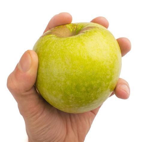 Dans Une Main Une Pomme Verte Disolement Sur Un Fond Blanc Image Stock
