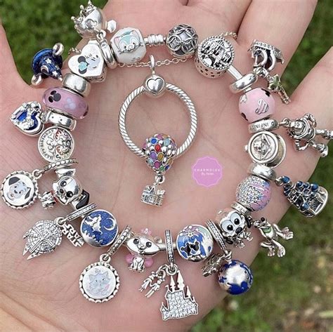 A Hand Holding A Bunch Of Charms In It S Palm
