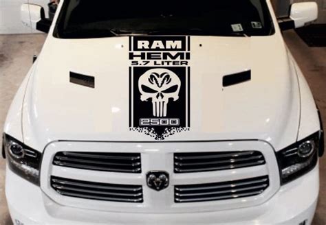 The Front End Of A White Truck With A Sticker On It S Hood