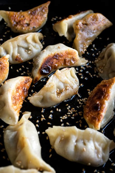 I serve the gyoza really simple with a sprinkling of sesame seeds and a flavorful dipping sauce on the side. Cabbage & Mushroom Gyoza with Orange Sesame Dipping Sauce - The Original Dish