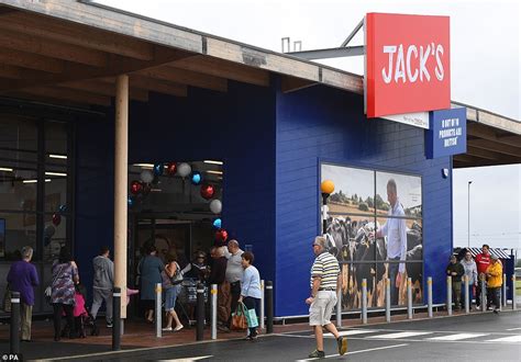 Shoppers Queue In Rain To Be First Into Tescos New Store Jacks