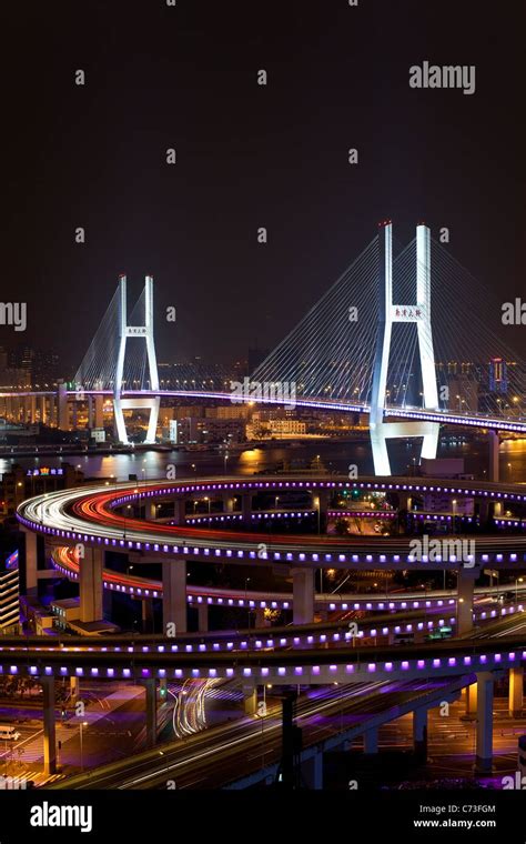 High Angle Wide Shot Traffic On Nanpu Bridge Spiral Illuminated Bridge