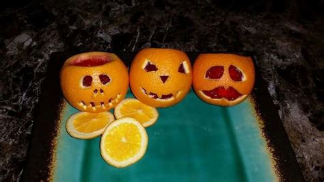 Halloween Jack O Lantern Made With Oranges And Jellow Top It Off With