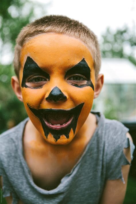 Little Boy With Jack O Lantern Face Paint For Halloween Del