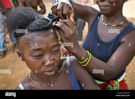 A Young Woman Gets Her Hair Braided In Freetown Sierra Leone West