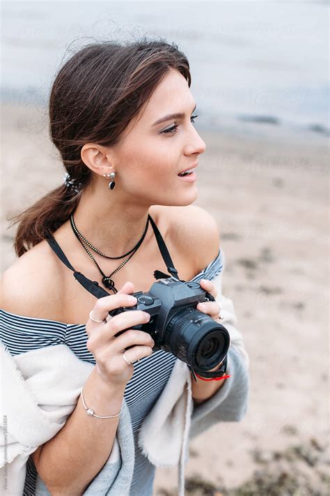 Beautiful Young Woman Photographer Outdoor Portrait By Stocksy Contributor Viktor Solomin