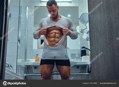 Handsome Muscular Male Ripping His Wet White Shirt Stylish Twin Stock