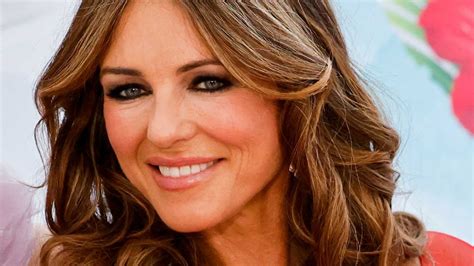 Elizabeth Hurley Sizzles In Figure Hugging Dress With Thigh High Slit