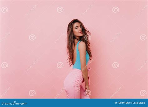 Gorgeous Brunette Caucasian Girl In Pink Pants Posing In Studio Indoor