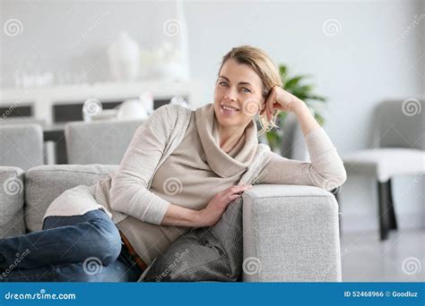 Mature Woman Relaxing On Couch Stock Photo Image Of Smile Indoors