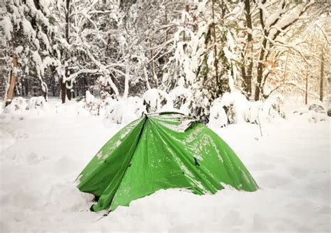 Camping Tent On Snow In Snowy Winter Forest After Snowfall Stock Photo